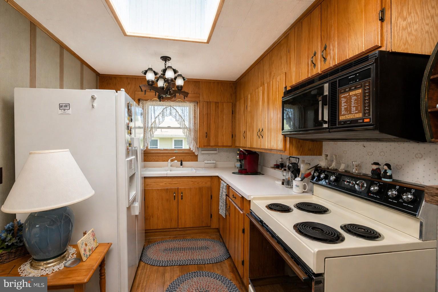 682 Marsh Hill Road McHenry, MD 21541 - Photo 15 of 40 a kitchen with a sink a stove and cabinets