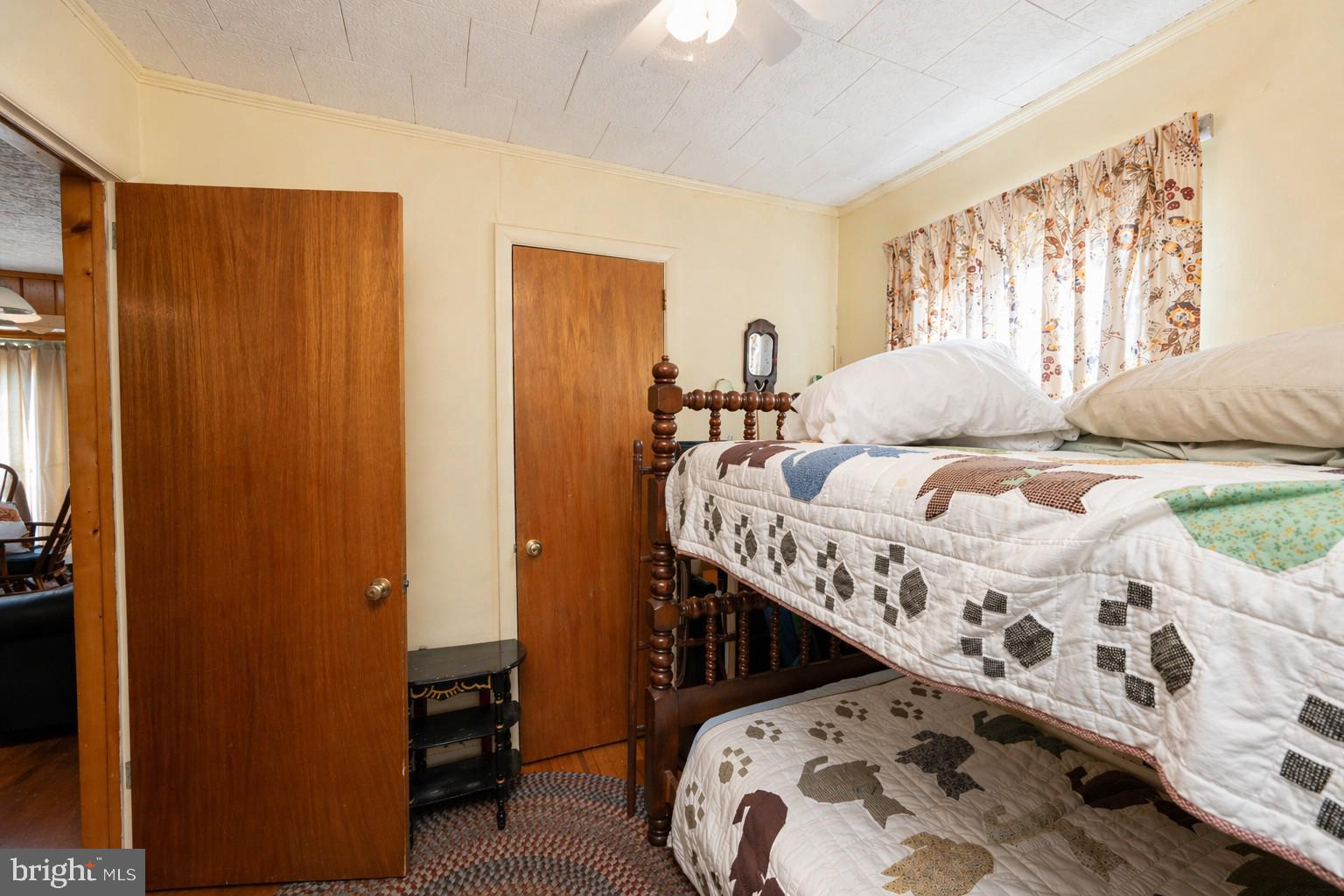 682 Marsh Hill Road McHenry, MD 21541 - Photo 19 of 40 a bedroom with a bed next to a window