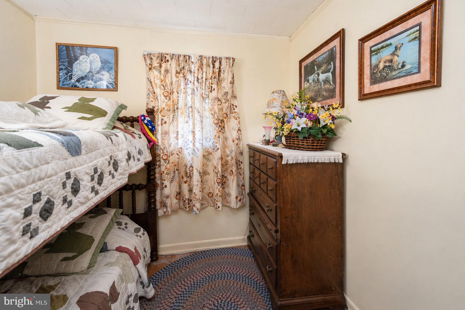 682 Marsh Hill Road McHenry, MD 21541 - Photo 20 of 40 a bed room with a bed and a painting on the wall