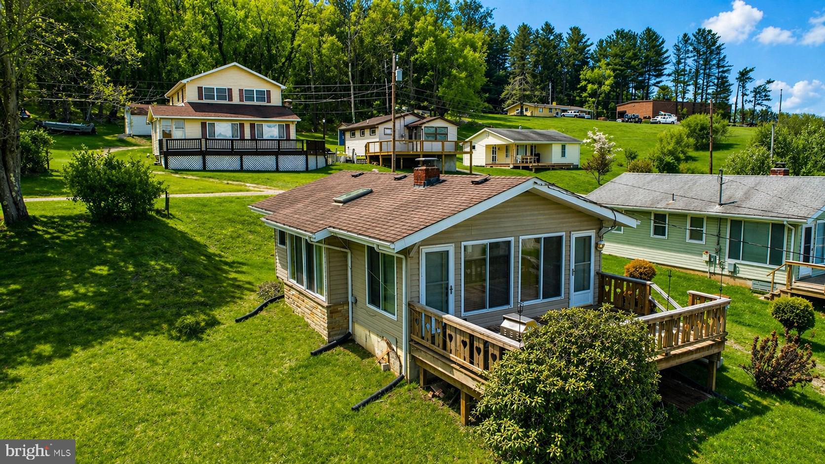 682 Marsh Hill Road McHenry, MD 21541 - Photo 2 of 40 an aerial view of a house with a garden