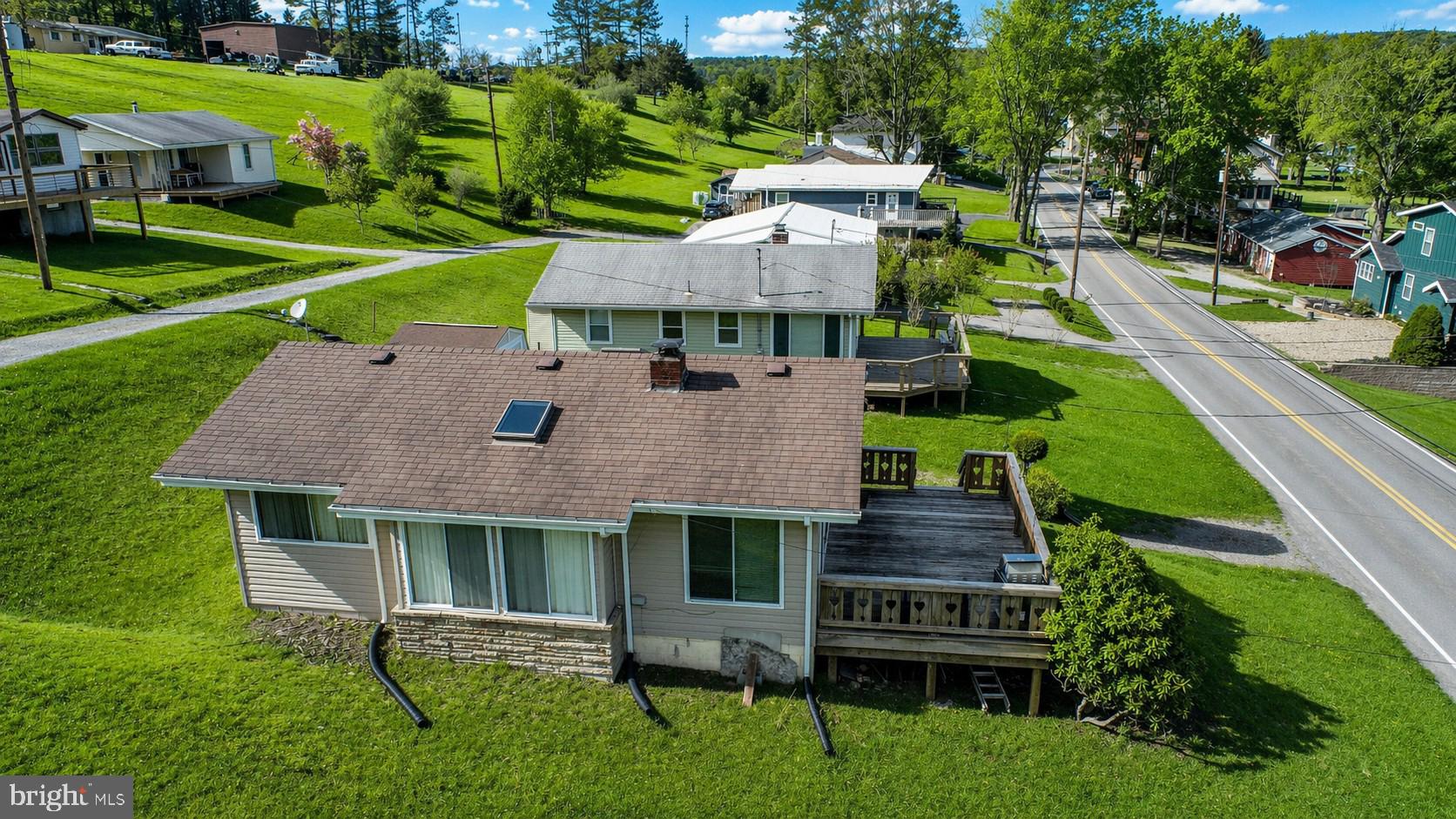 682 Marsh Hill Road McHenry, MD 21541 - Photo 40 of 40 an aerial view of a house with swimming pool garden and patio