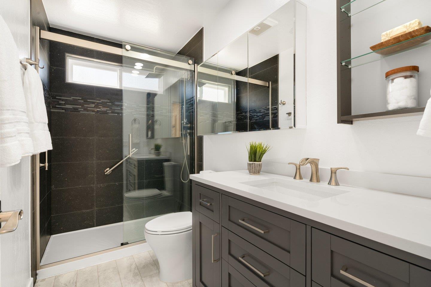 2 Ensenada Road San Carlos, CA 94070 - Photo 16 of 31 a bathroom with a sink a toilet and shower