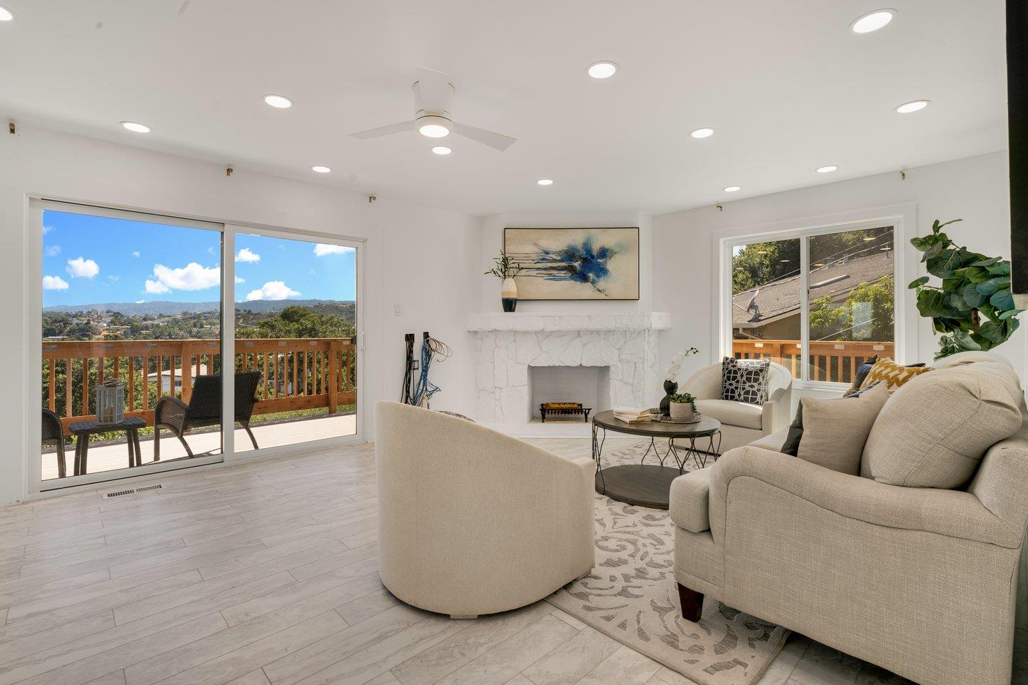 2 Ensenada Road San Carlos, CA 94070 - Photo 2 of 31 a living room with fireplace furniture and a large window