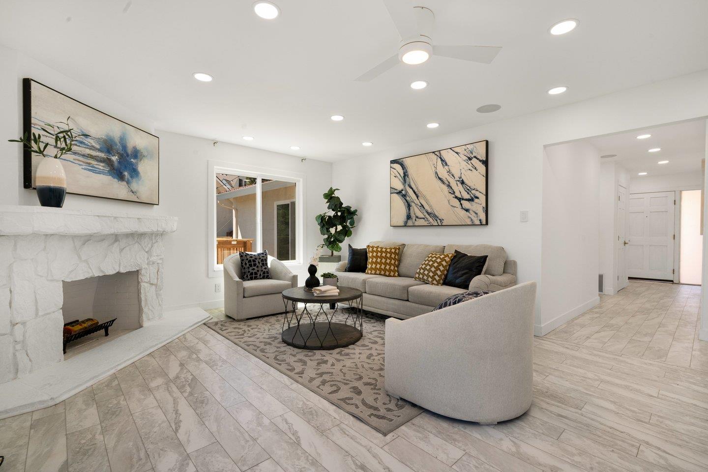 2 Ensenada Road San Carlos, CA 94070 - Photo 3 of 31 a living room with furniture and a fireplace