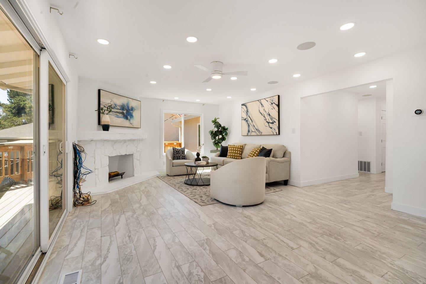 2 Ensenada Road San Carlos, CA 94070 - Photo 5 of 31 a living room with furniture and a fireplace