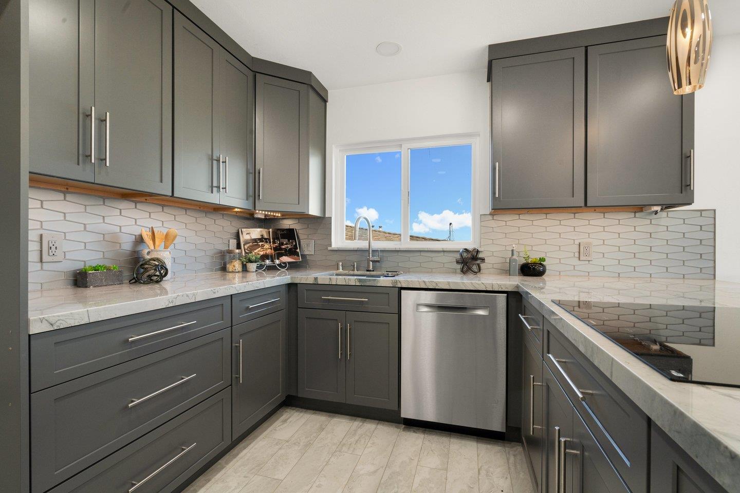 2 Ensenada Road San Carlos, CA 94070 - Photo 7 of 31 a kitchen with a sink stove and cabinets