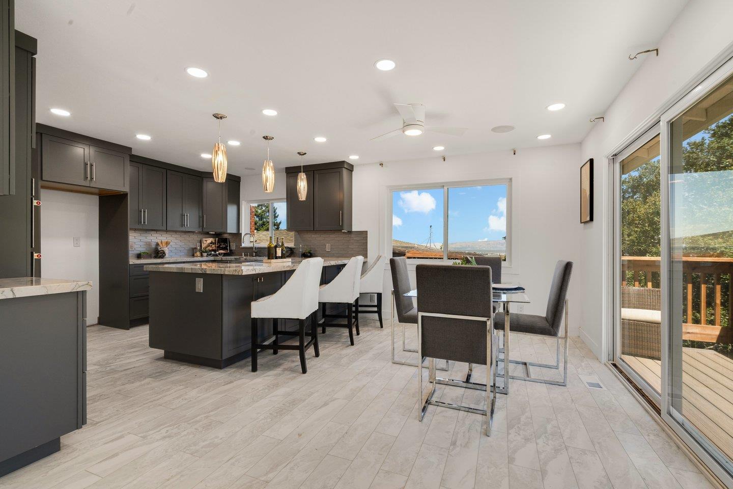 2 Ensenada Road San Carlos, CA 94070 - Photo 10 of 31 a living room with stainless steel appliances kitchen island granite countertop furniture and a dining table with kitchen view