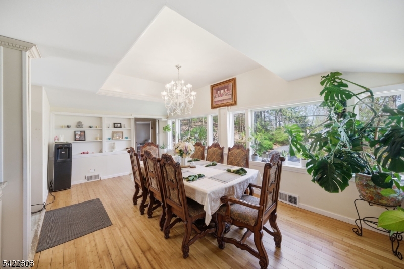 399 Springbrook Trail Sparta, NJ 07871 - Photo 11 of 27 a view of a dining room with furniture window and wooden floor