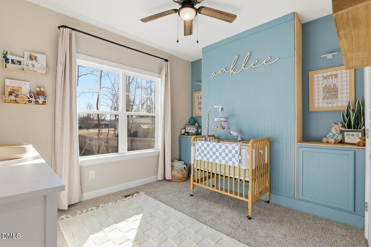 110 Oak Street Pine Level, NC 27568 - Photo 19 of 30 a bedroom with a bed and a window