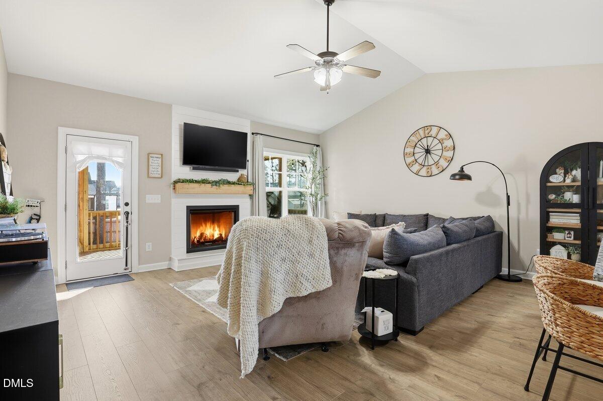 110 Oak Street Pine Level, NC 27568 - Photo 5 of 30 a living room with furniture and a fireplace
