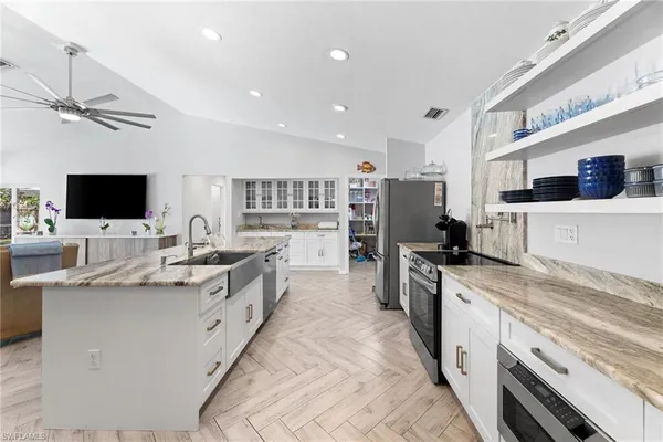 a living room with furniture and flat screen tv