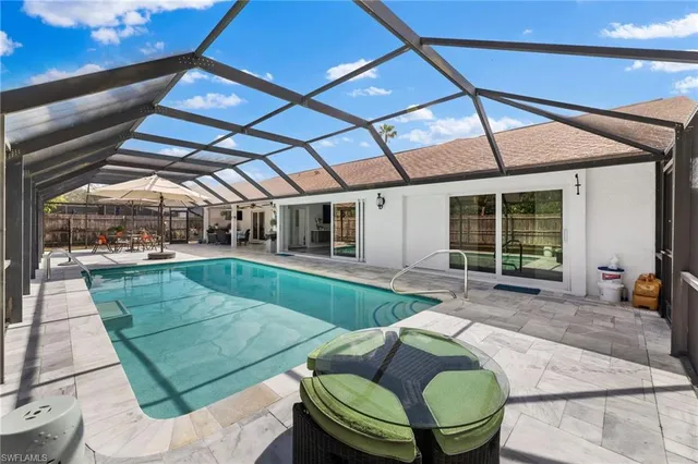 a view of a backyard with sitting area