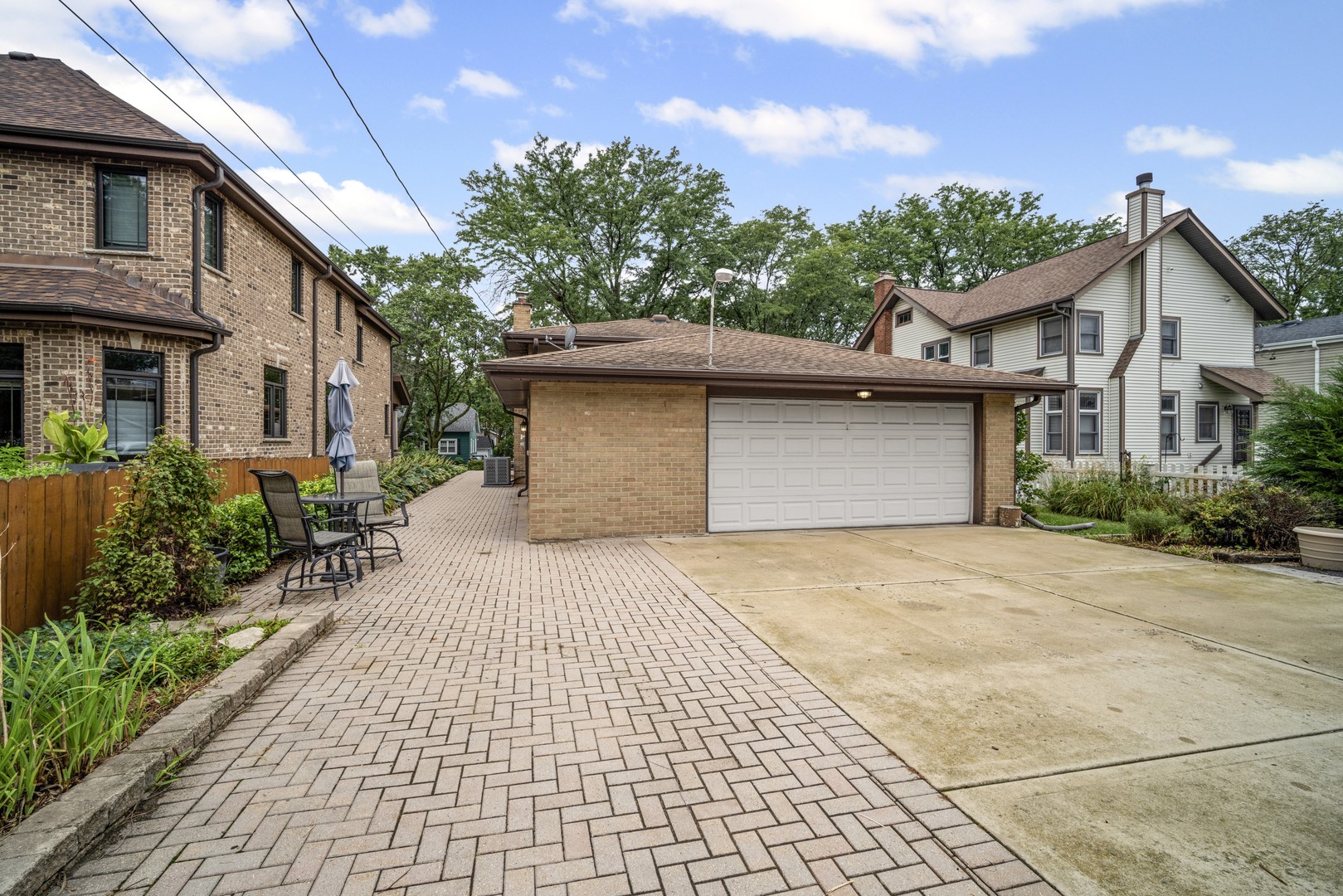 421 North Elm Street Itasca, IL 60143 - Photo 21 of 21 a front view of a house with a yard and potted plants