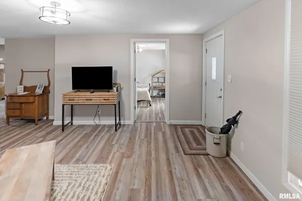 a view of a livingroom with furniture and wooden floor