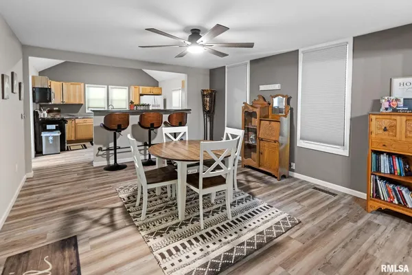 a view of a dining room with furniture and window