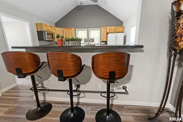 a kitchen with a window a sink and white appliances