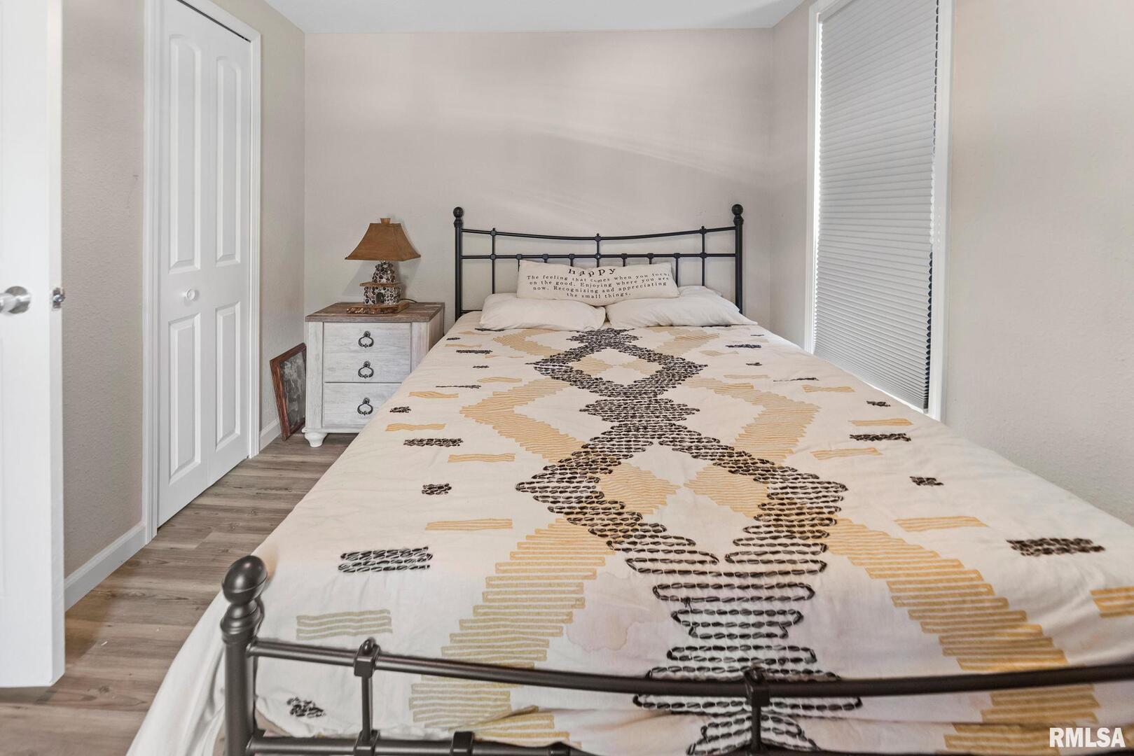 416 South Maple Street Salem, IL 62881 - Photo 24 of 31 a large bed sitting in a bedroom next to a window