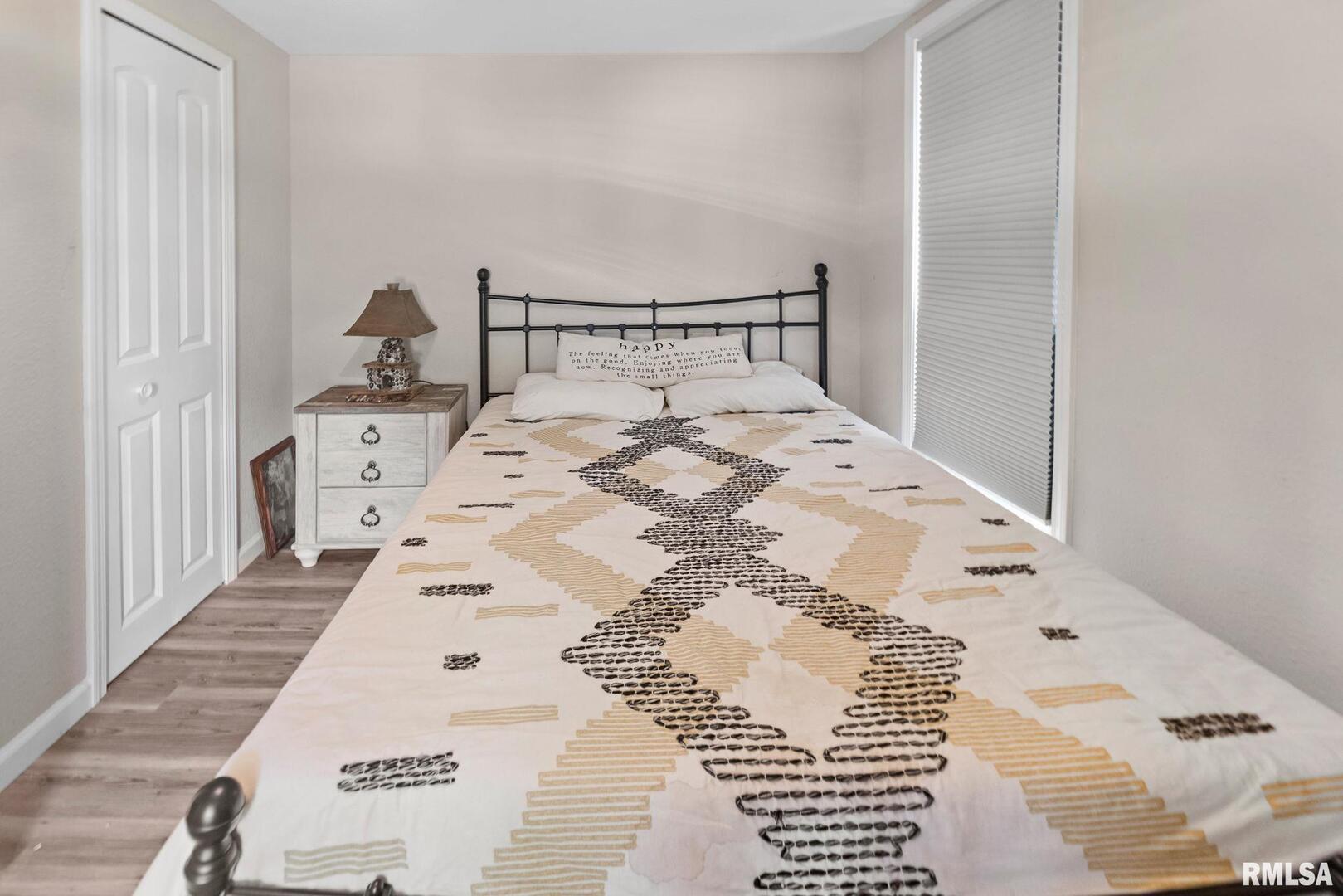 416 South Maple Street Salem, IL 62881 - Photo 25 of 31 a bedroom with a bed and wooden floor