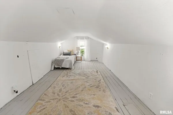 a big room with closet and windows