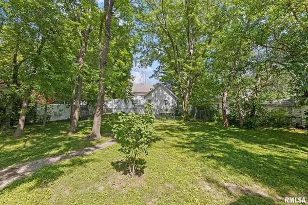 a view of a patio in the backyard