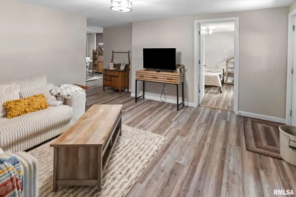 a view of a livingroom with furniture and a flat screen tv