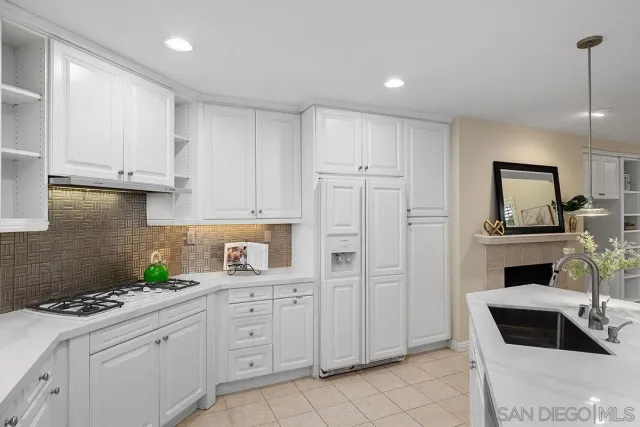 a living room with furniture a window and a fireplace