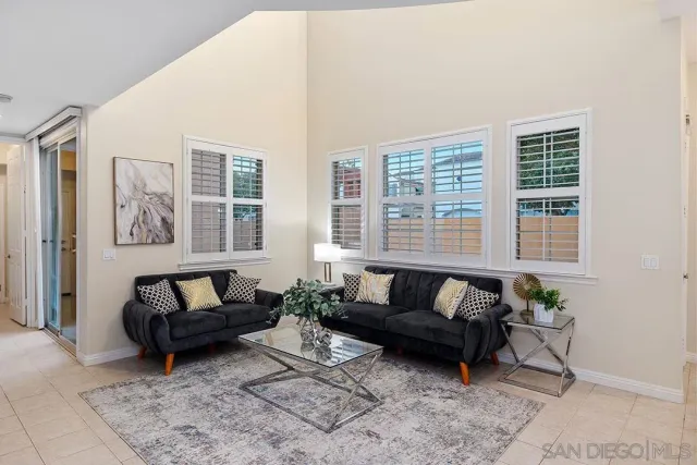 a view of a dining room with furniture and window