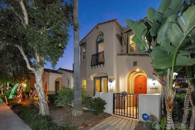 a view of a large building with large windows and a flower garden