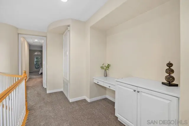 a bedroom with a bed and a chair