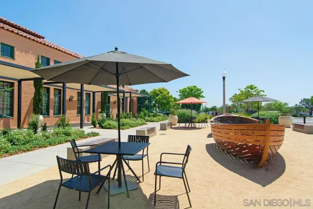 a view of beach and palm trees