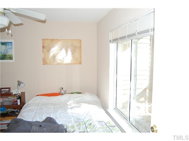 1500 Graduate Lane, Unit 104 Raleigh, NC 27606 - Photo 11 of 15 a view of a bedroom with a bed and a window