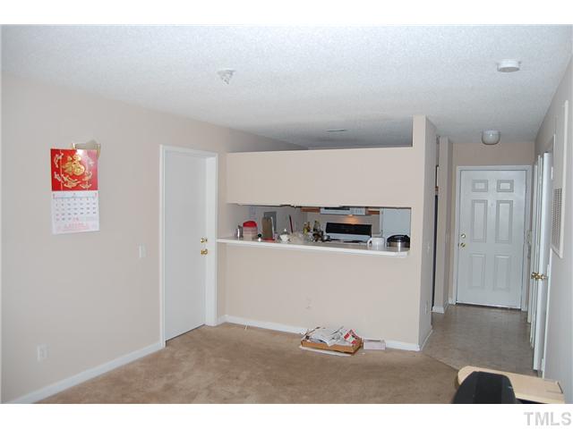 1500 Graduate Lane, Unit 104 Raleigh, NC 27606 - Photo 14 of 15 a kitchen with cabinets and appliances