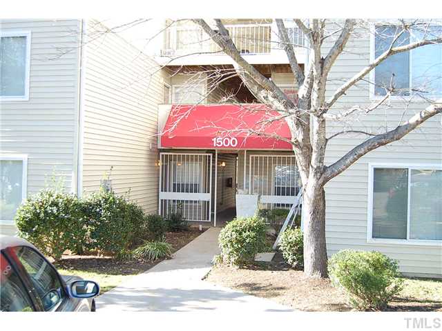 1500 Graduate Lane, Unit 104 Raleigh, NC 27606 - Photo 2 of 15 a front view of a house with a yard
