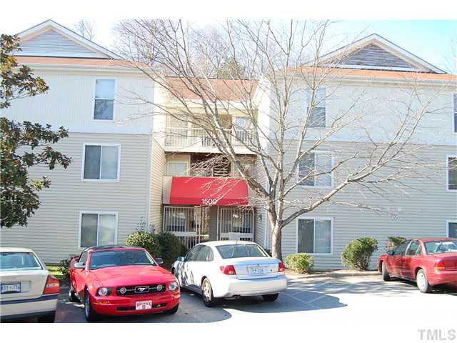 1500 Graduate Lane, Unit 104 Raleigh, NC 27606 - Photo 3 of 15 a front view of a house with cars parked