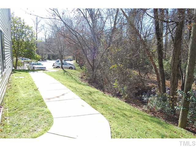 1500 Graduate Lane, Unit 104 Raleigh, NC 27606 - Photo 6 of 15 a view of swimming pool from a garden