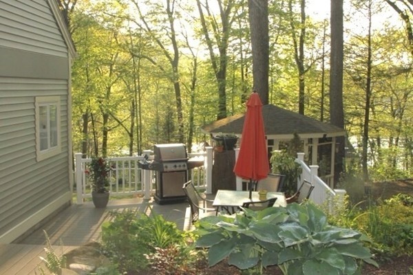 2 Stony Hill Road Holland, MA 01521 - Photo 20 of 24 a backyard of a house with table and chairs