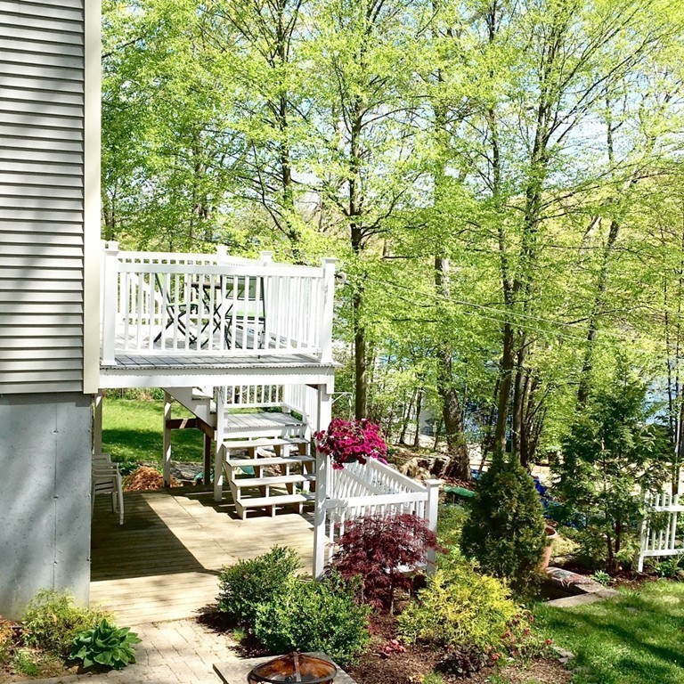 2 Stony Hill Road Holland, MA 01521 - Photo 21 of 24 a balcony with outdoor seating and flowers