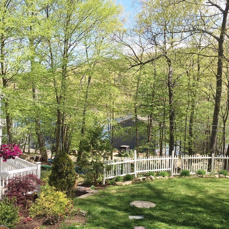 2 Stony Hill Road Holland, MA 01521 - Photo 22 of 24 a view of a small yard and a fountain