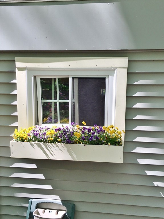 2 Stony Hill Road Holland, MA 01521 - Photo 23 of 24 a front view of a house with flowers