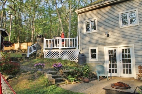 2 Stony Hill Road Holland, MA 01521 - Photo 3 of 24 a front view of a house with a yard