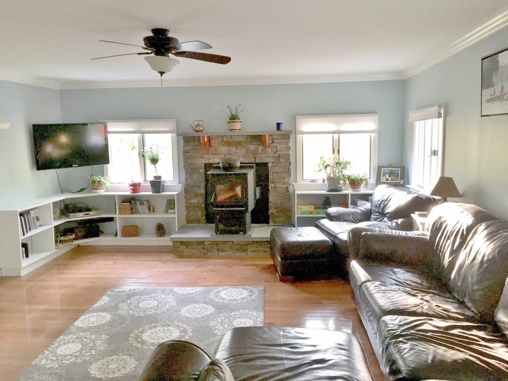 2 Stony Hill Road Holland, MA 01521 - Photo 8 of 24 a living room with furniture a fireplace and a flat screen tv