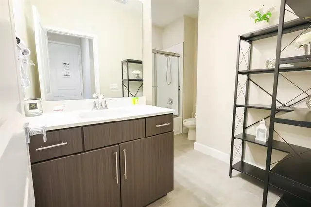 a bathroom with a sink and a mirror