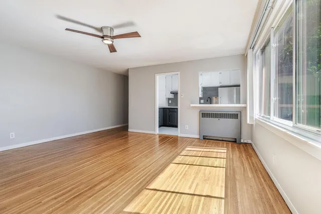 a view of a kitchen with a sink and dishwasher cabinets
