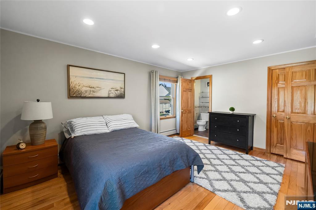 66 Roehrs Drive Wallington, NJ 07057 - Photo 21 of 37 a bedroom with a bed and wooden floor