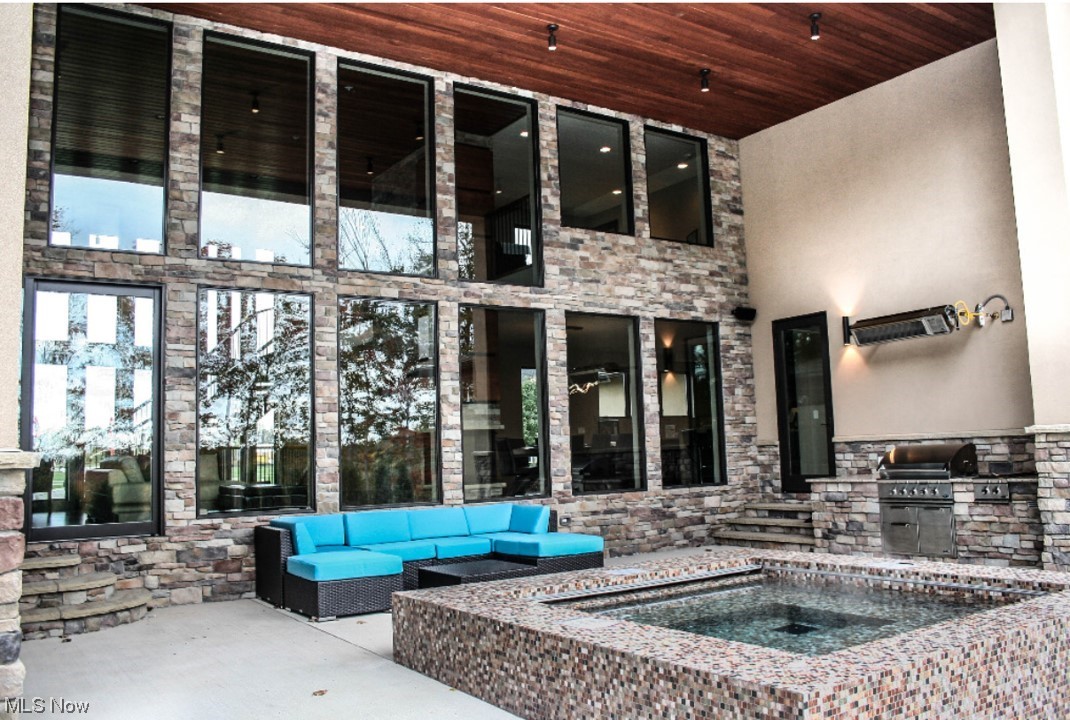 2300 Rivers Edge Drive Willoughby, OH 44094 - Photo 25 of 29 Outside Covered Patio with custom all-season jacuzzi w/ electric retractable cover