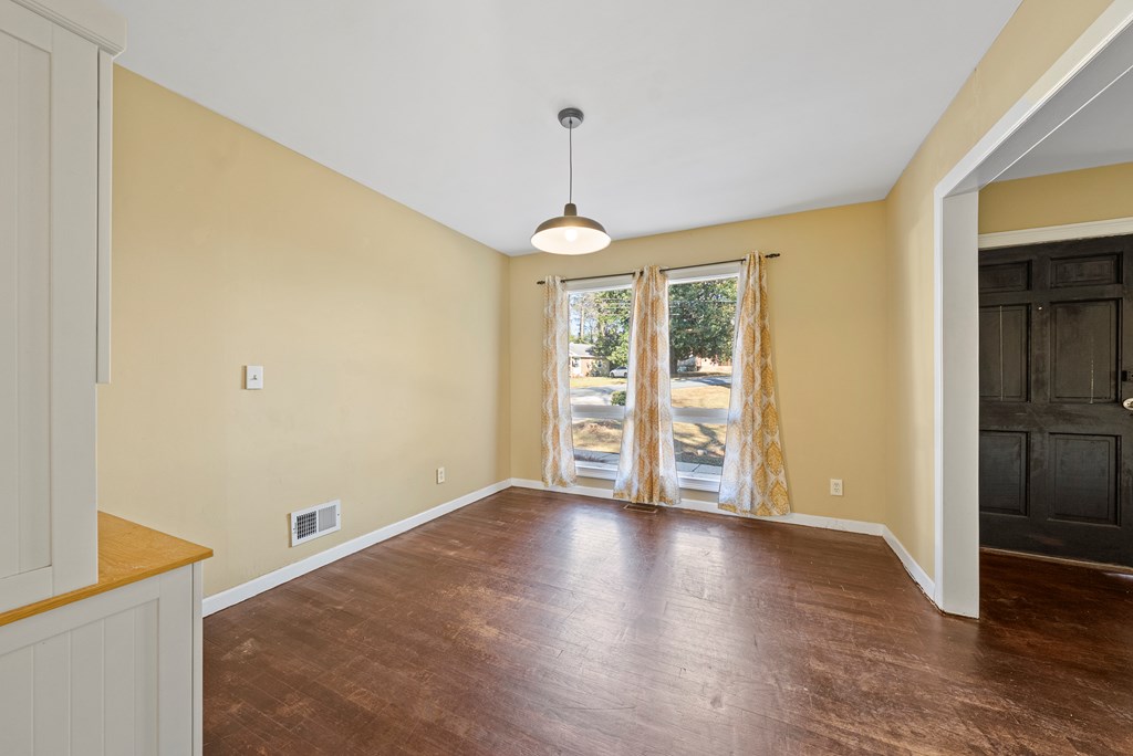 3630 Vernon Drive Columbus, GA 31909 - Photo 7 of 27 a view of an empty room with window and wooden floor