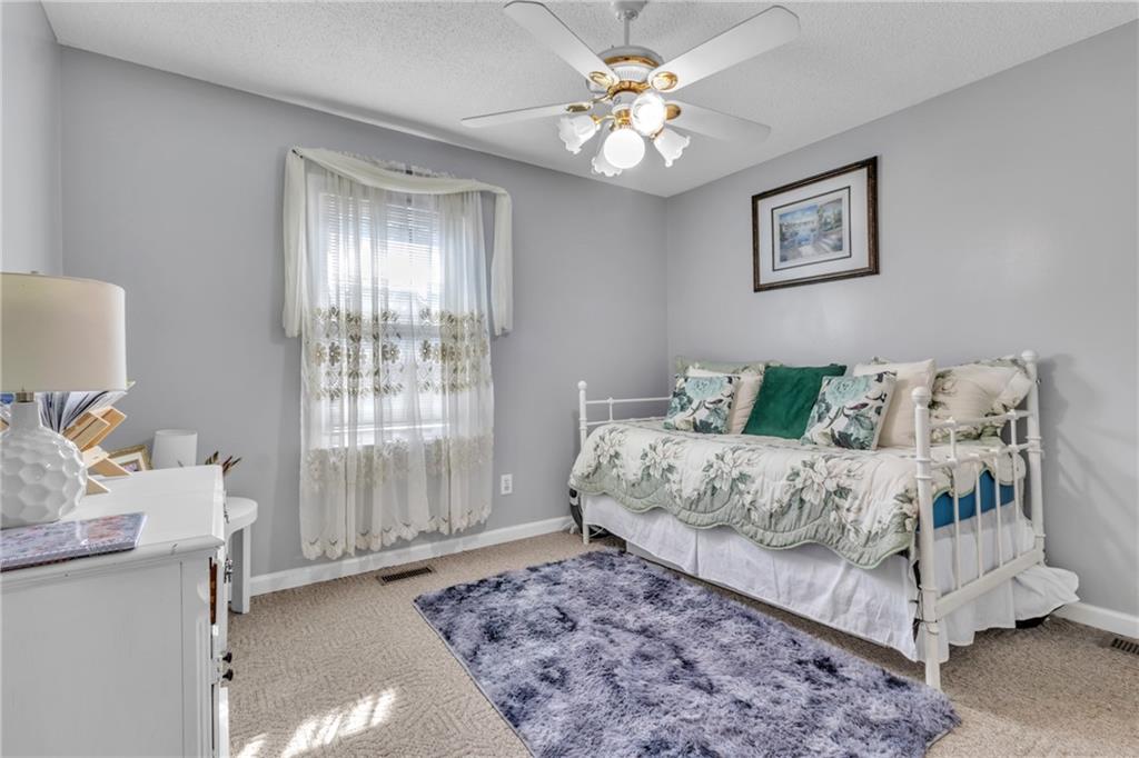 12 Ranger Road Southeast Cartersville, GA 30121 - Photo 16 of 51 a bedroom with a bed and a window