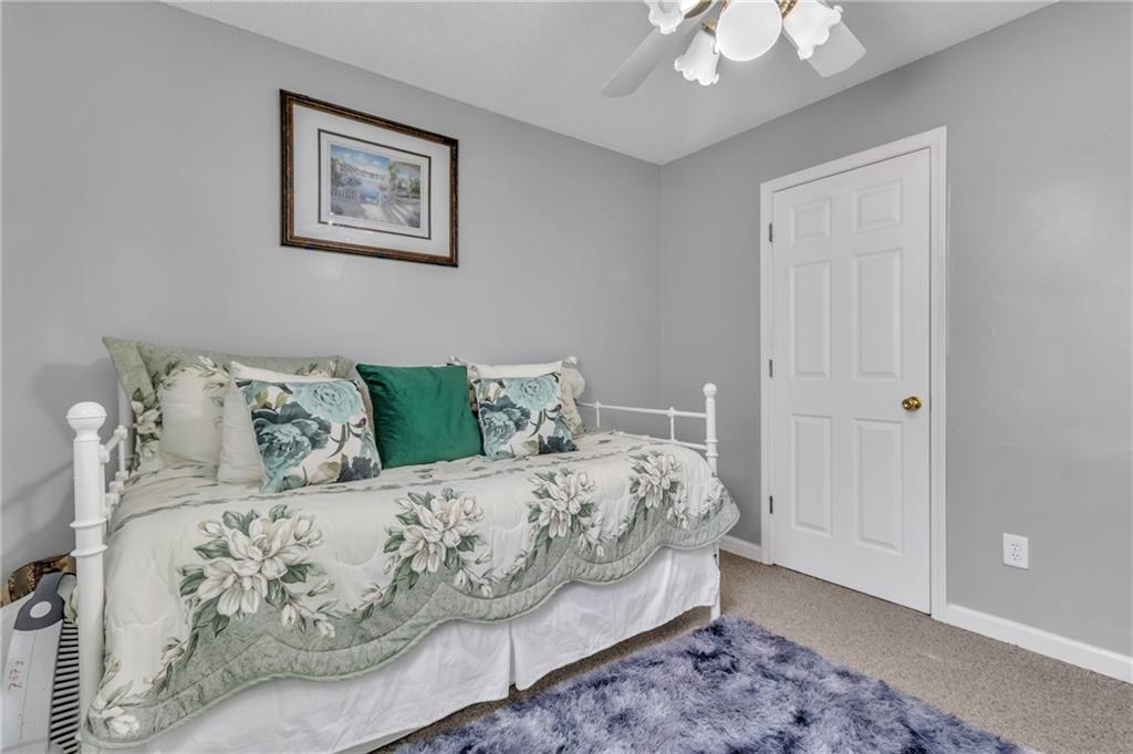 12 Ranger Road Southeast Cartersville, GA 30121 - Photo 17 of 51 a bedroom with a bed and a painting on the wall