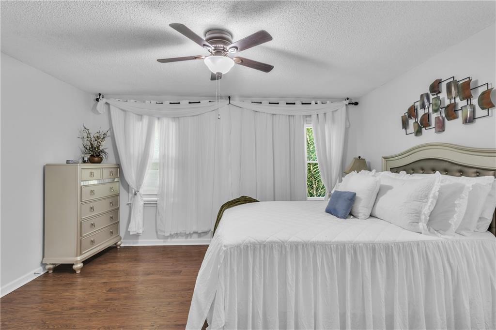 12 Ranger Road Southeast Cartersville, GA 30121 - Photo 23 of 51 a bedroom with a bed and a chandelier