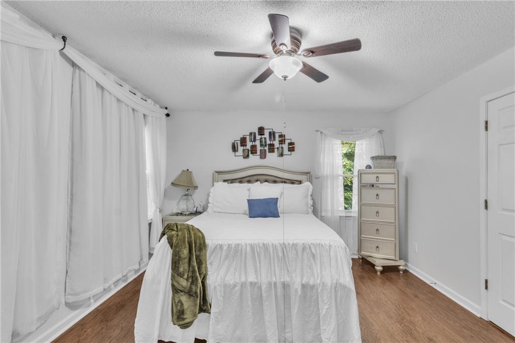 12 Ranger Road Southeast Cartersville, GA 30121 - Photo 24 of 51 a bedroom with a bed and a chandelier